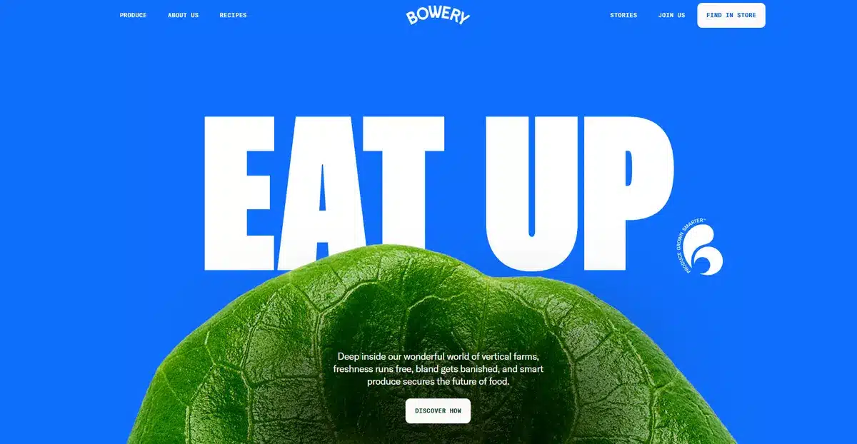 Bowery's website with a sky blue background and a spinach on the bottom of the website