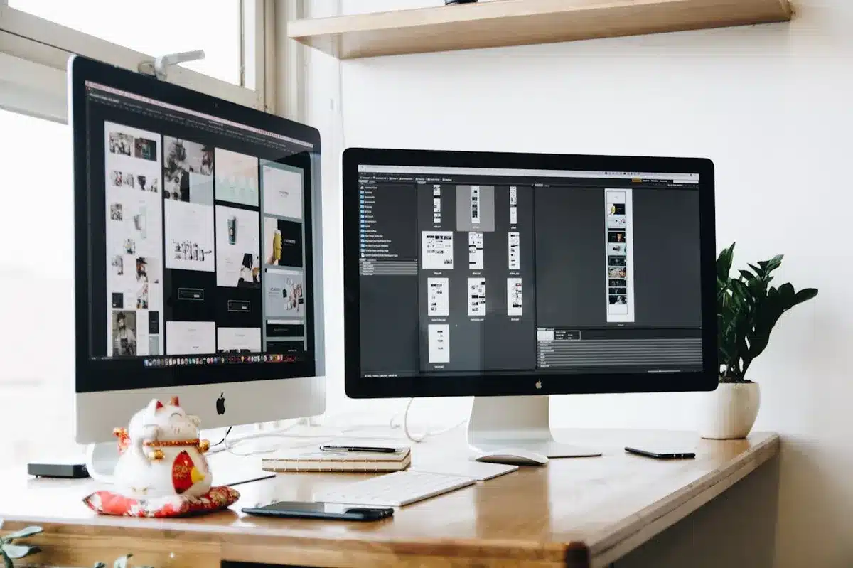 Monitors showing mockup for a website