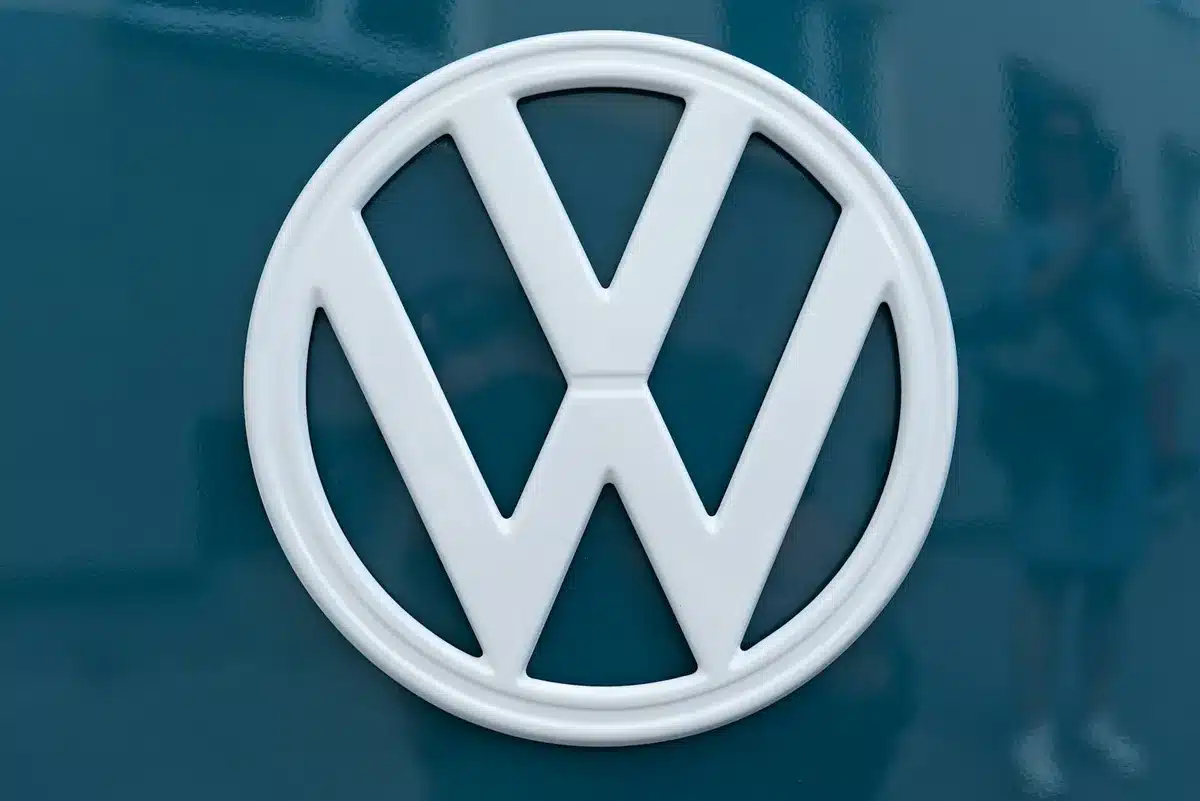 White Volkswagen logo on a blue background