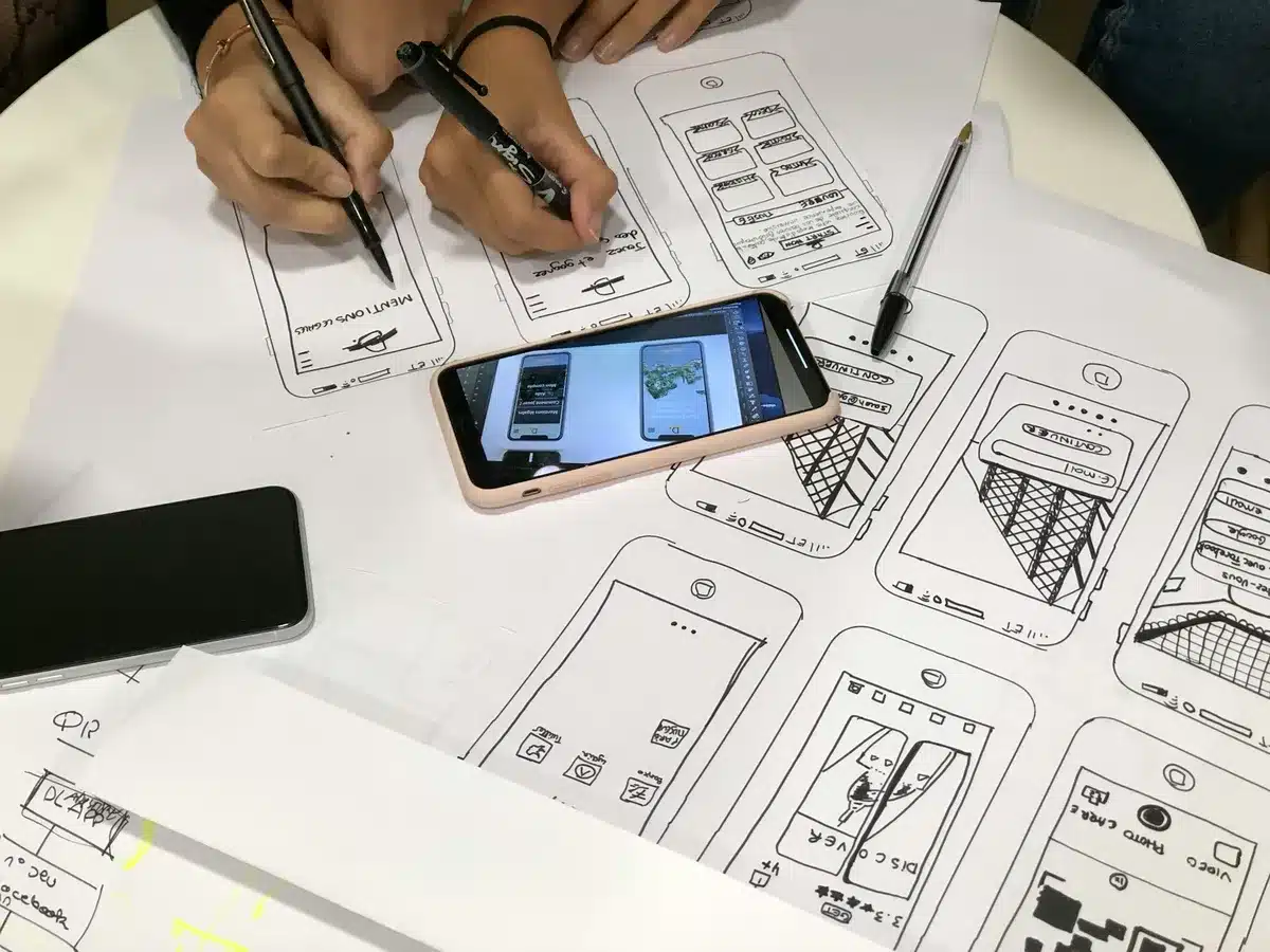 Web designers working on a mockup for a mobile website