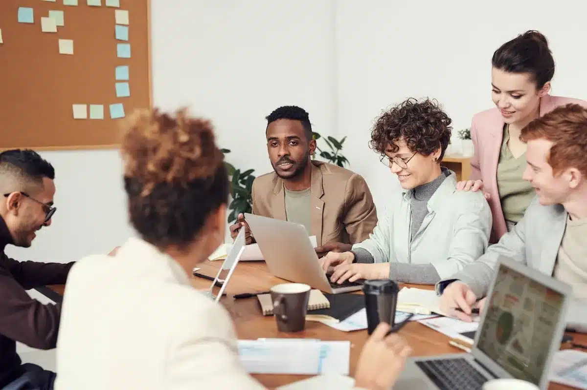 group meeting between 6 people about branding strategy 