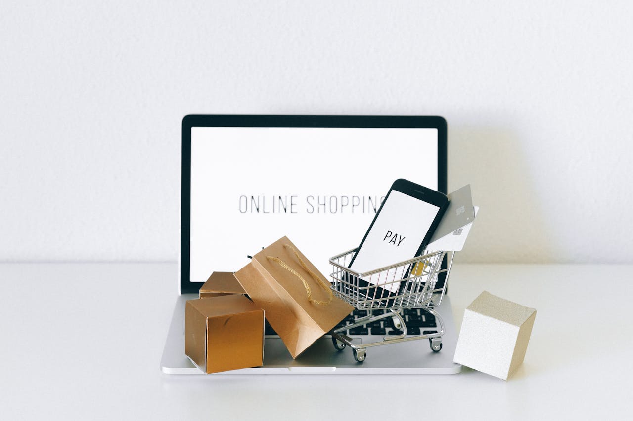 laptop with "online shopping" on the monitor