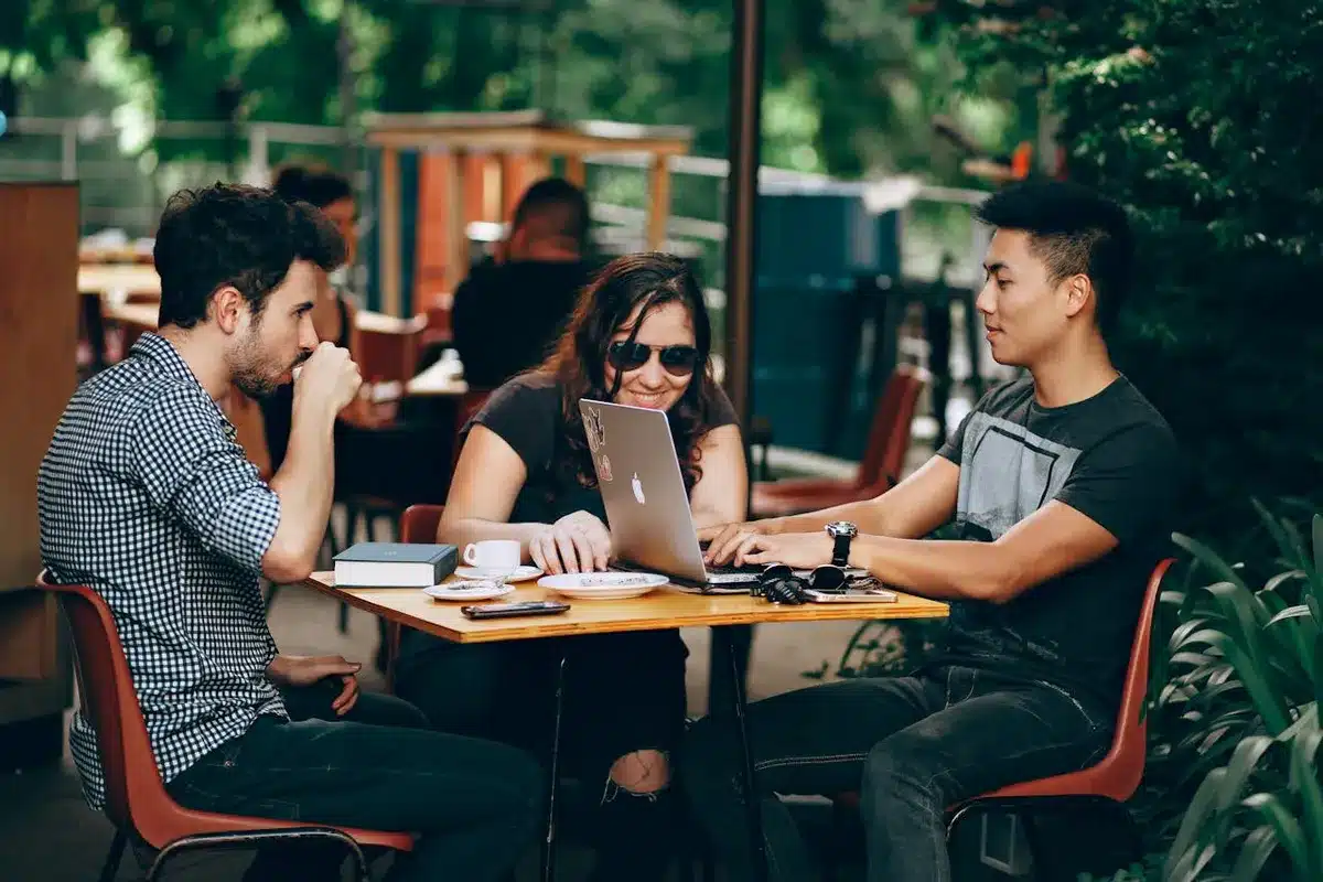 3 people working on their california startup