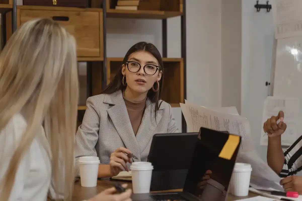 Coworkers discussing brand strategy for the company they work for