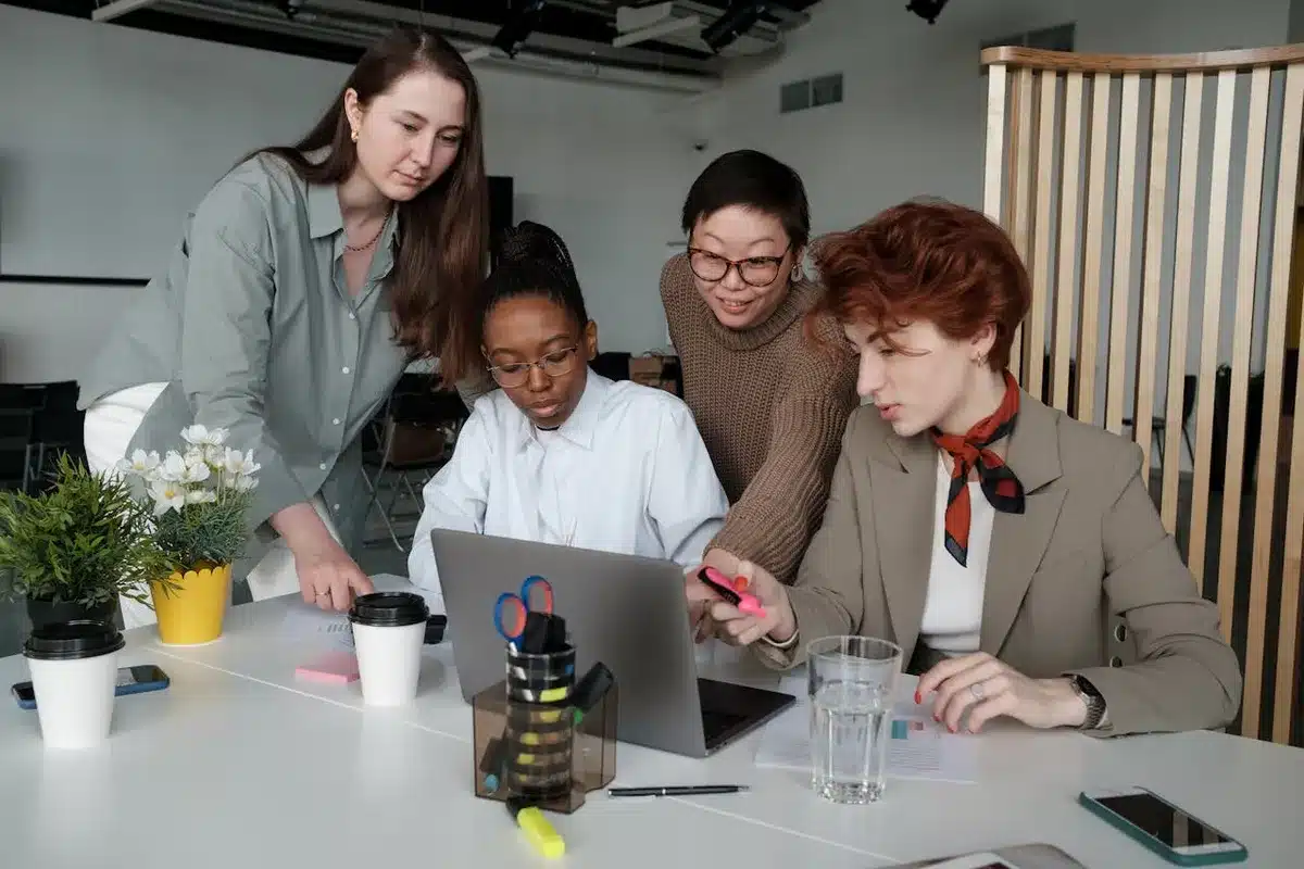 4 coworkers thinking about how to change the brand strategy of their company