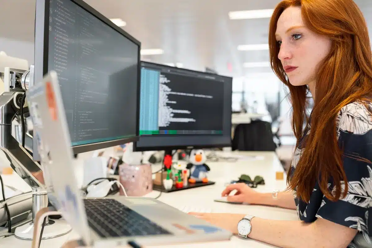 Red haired woman working on an apartment SEO strategy