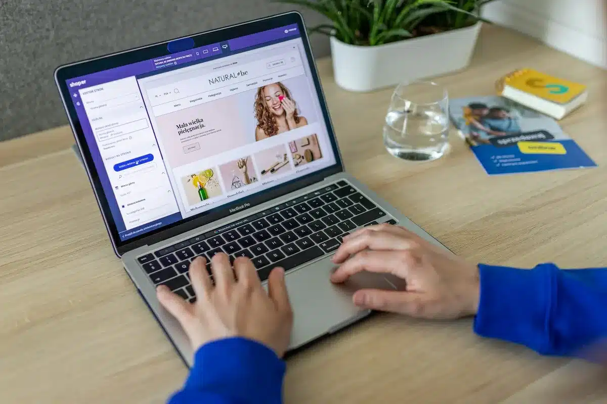 Person modifying Shopify store on their macbook